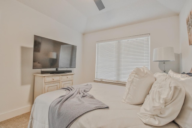 bedroom with ceiling fan and light carpet