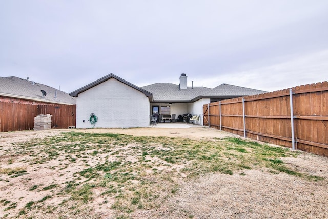 rear view of house featuring a patio area