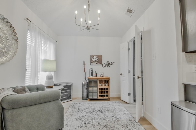 interior space featuring a chandelier and light hardwood / wood-style floors