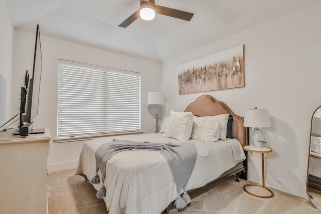 bedroom with ceiling fan and light colored carpet