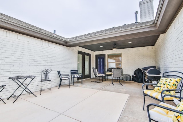 view of patio featuring ceiling fan