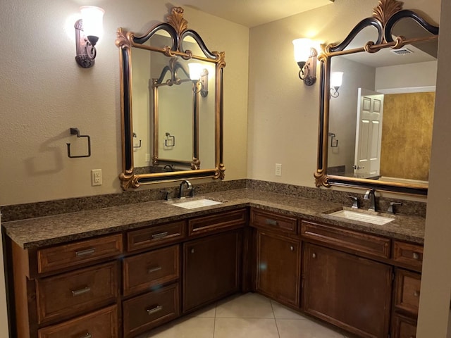 bathroom with tile patterned floors and vanity