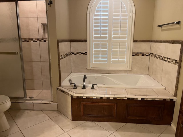 bathroom with separate shower and tub, tile patterned floors, and toilet