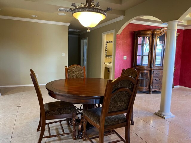 dining space featuring ornamental molding, decorative columns, and light tile patterned floors