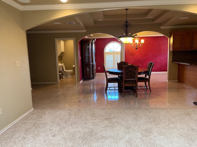 dining room featuring a notable chandelier, ornamental molding, a raised ceiling, and light tile patterned flooring