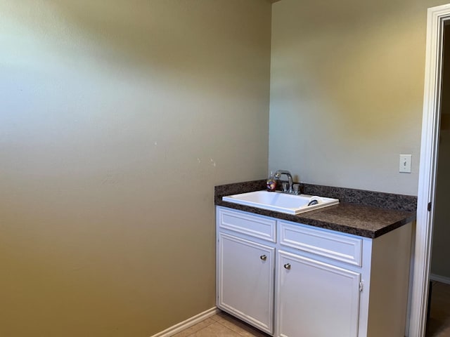 bathroom featuring tile patterned flooring and vanity