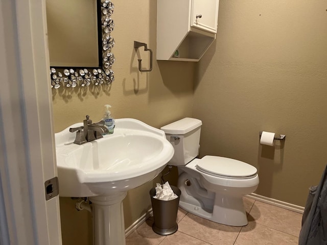 bathroom featuring tile patterned floors and toilet