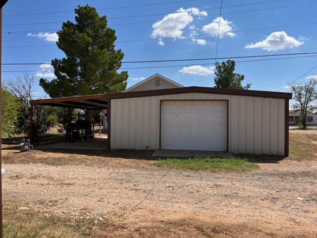 garage featuring a carport