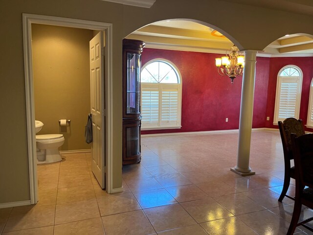 tiled dining space with ornate columns