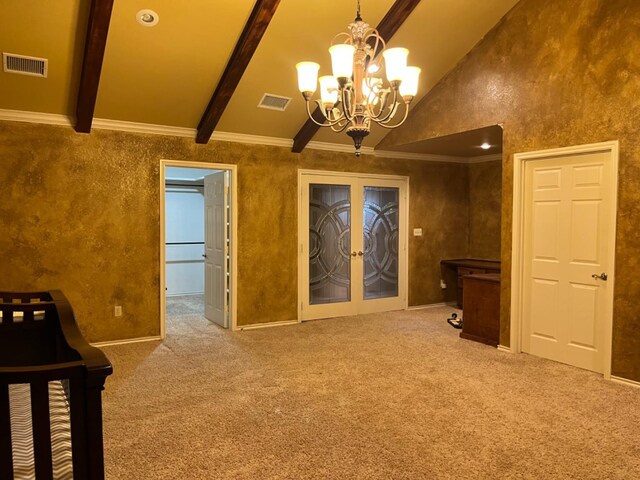 interior space with an inviting chandelier, beam ceiling, high vaulted ceiling, ornamental molding, and french doors