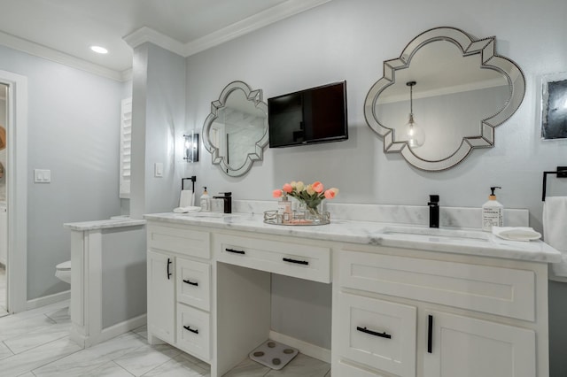 bathroom with vanity, crown molding, and toilet