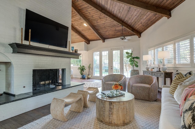 living room with wood-type flooring, high vaulted ceiling, a brick fireplace, wooden ceiling, and beamed ceiling