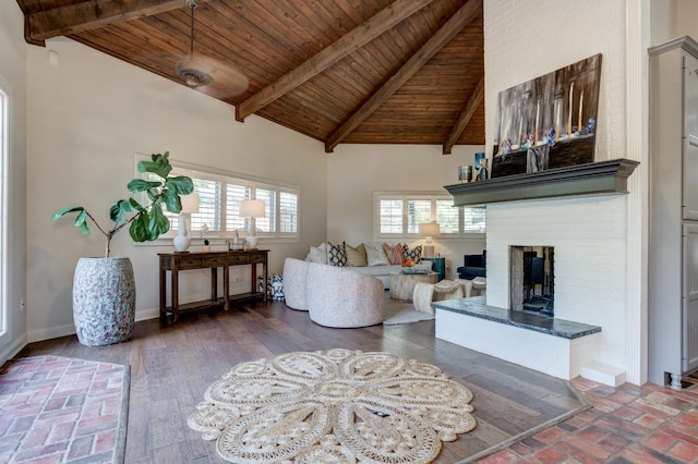 living room with wood ceiling, a healthy amount of sunlight, a fireplace, and dark wood-type flooring