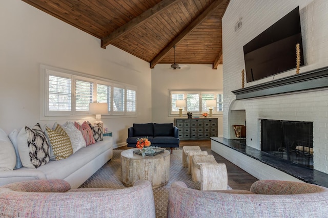 living room featuring hardwood / wood-style flooring, high vaulted ceiling, wood ceiling, and beam ceiling