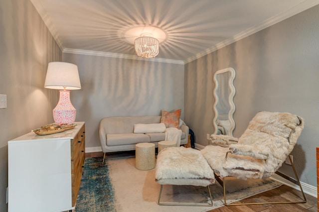 living area featuring an inviting chandelier, ornamental molding, and dark hardwood / wood-style floors