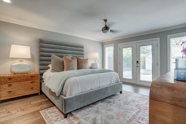 bedroom featuring ornamental molding, access to exterior, light hardwood / wood-style floors, ceiling fan, and french doors