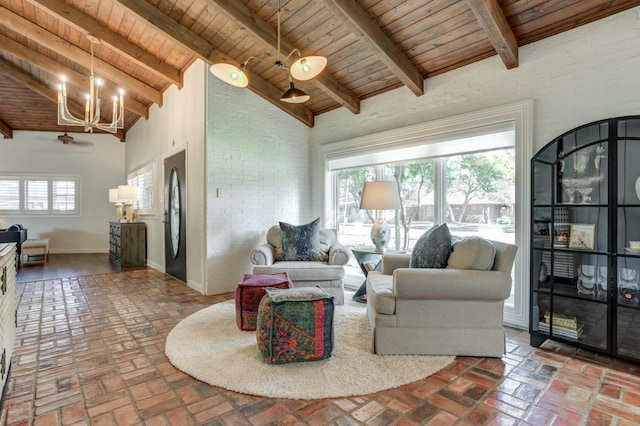 living room featuring wood ceiling, brick wall, and beam ceiling