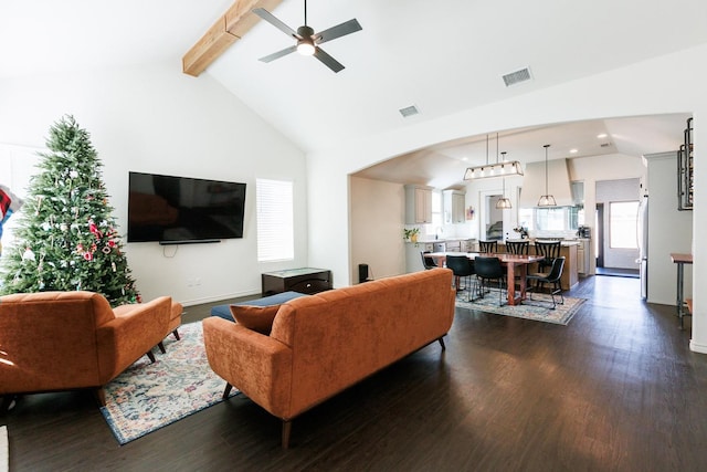 living room with dark hardwood / wood-style flooring, beam ceiling, and high vaulted ceiling