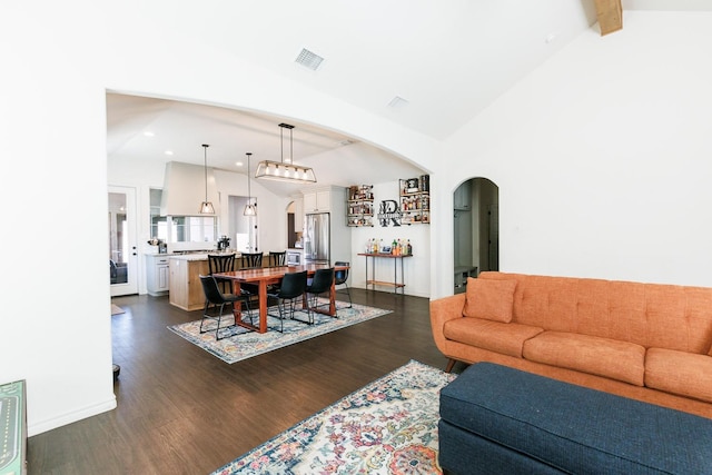 living room with beamed ceiling, dark hardwood / wood-style floors, and high vaulted ceiling