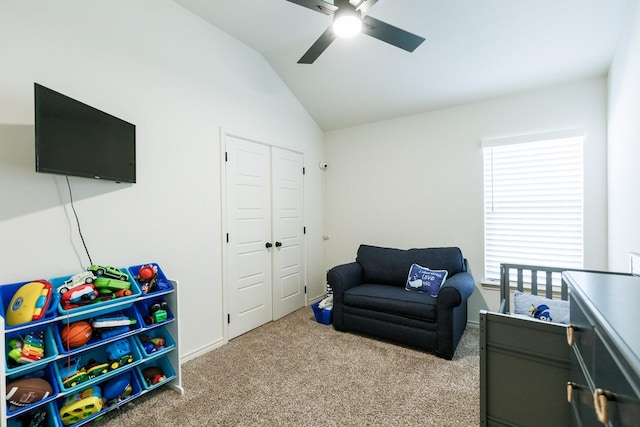 recreation room with lofted ceiling, light colored carpet, and ceiling fan