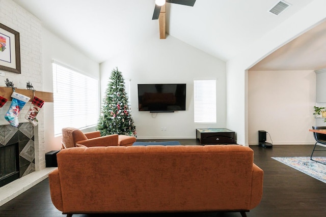 living room with ceiling fan, high vaulted ceiling, dark hardwood / wood-style floors, a fireplace, and beamed ceiling