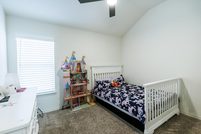 carpeted bedroom featuring ceiling fan and vaulted ceiling