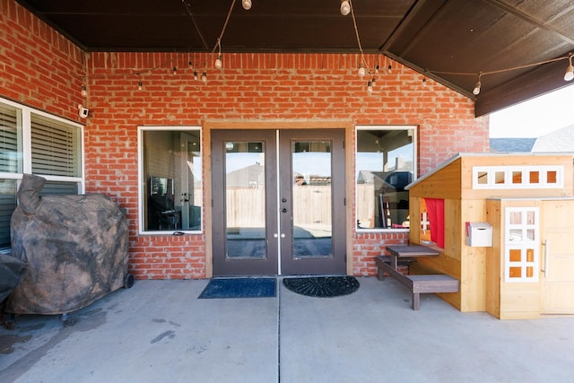 doorway to property featuring french doors and a patio area