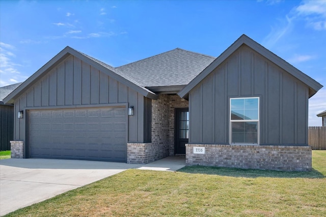 view of front of home featuring a garage and a front lawn