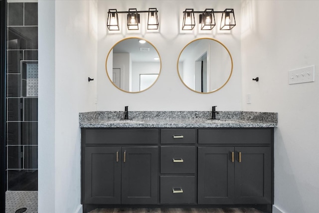 bathroom featuring vanity and a tile shower