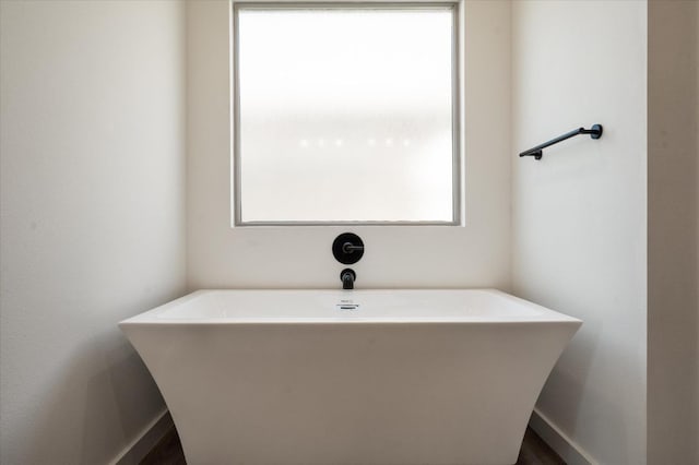 bathroom featuring a tub