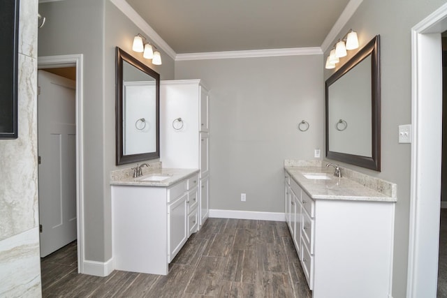 bathroom featuring ornamental molding and vanity