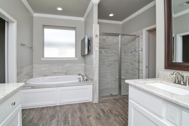 bathroom with vanity, ornamental molding, and hardwood / wood-style floors