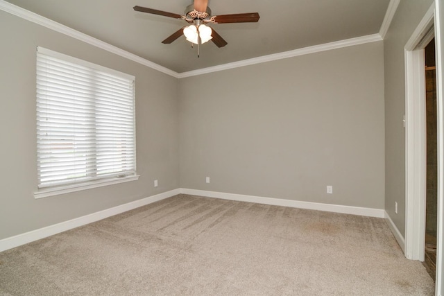 unfurnished room featuring ornamental molding, carpet floors, and ceiling fan