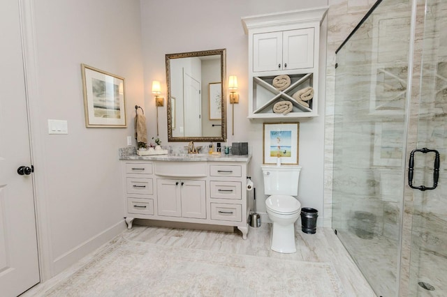 bathroom featuring walk in shower, vanity, and toilet