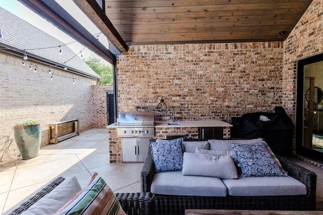 view of patio / terrace featuring a grill, area for grilling, and sink