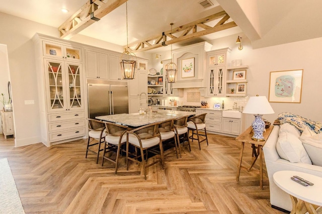 dining room with sink and light parquet flooring