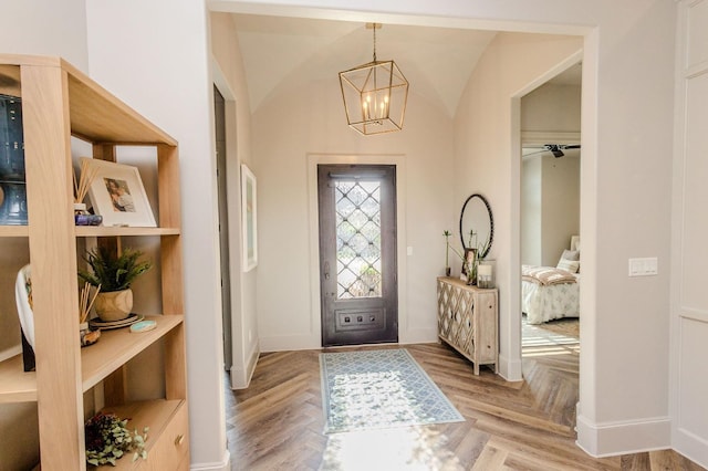 entrance foyer featuring parquet floors and an inviting chandelier