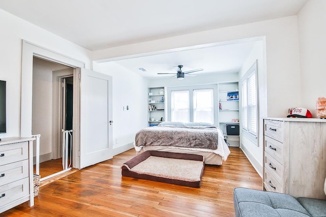 bedroom with ceiling fan and light hardwood / wood-style flooring