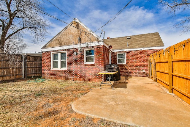 back of property with a patio area