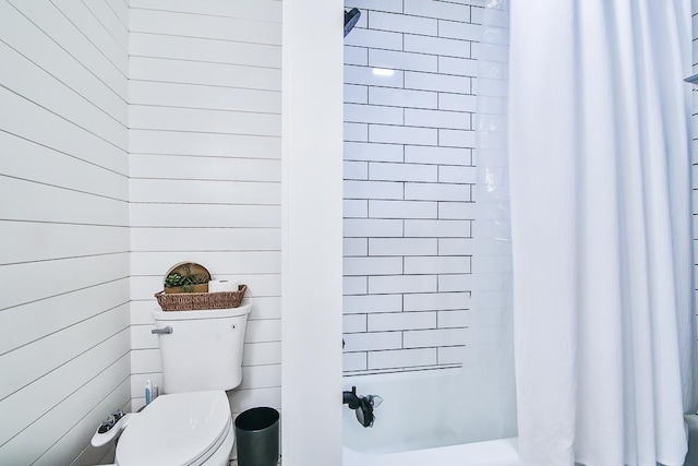 bathroom with shower / tub combo and toilet