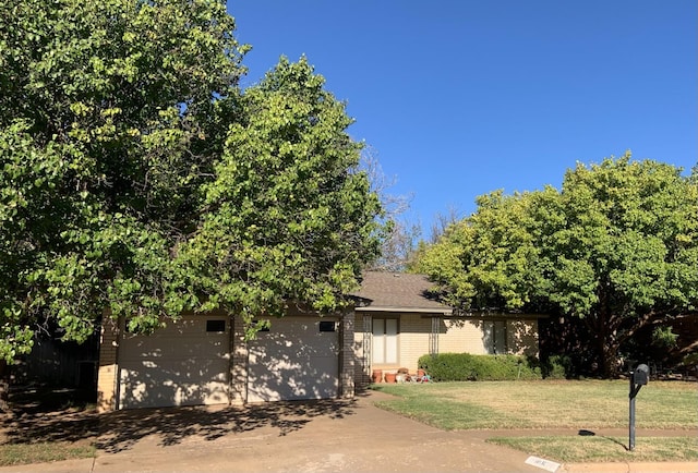 obstructed view of property featuring a front yard