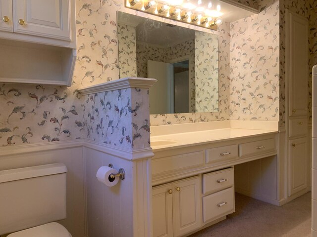 bathroom with vanity and toilet