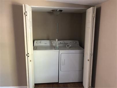 laundry room with independent washer and dryer