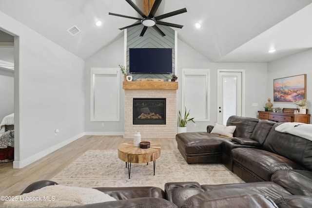 13803 Quinton Ave, Lubbock, TX 79424 - living room with a ceiling fan, wood finished floors, lofted ceiling, a fireplace, and recessed lighting