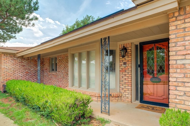 doorway to property featuring a porch