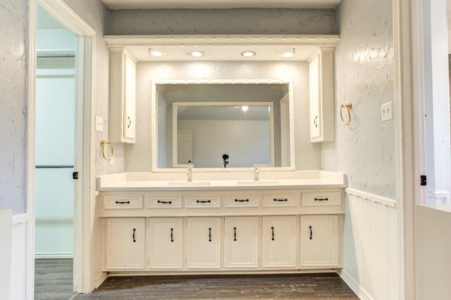 bathroom featuring vanity and wood-type flooring