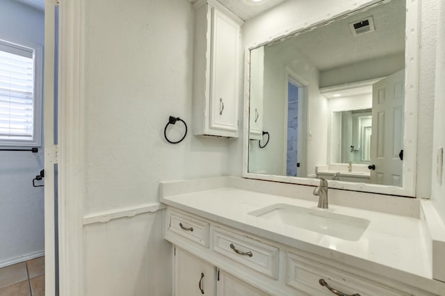 bathroom featuring vanity and tile patterned flooring