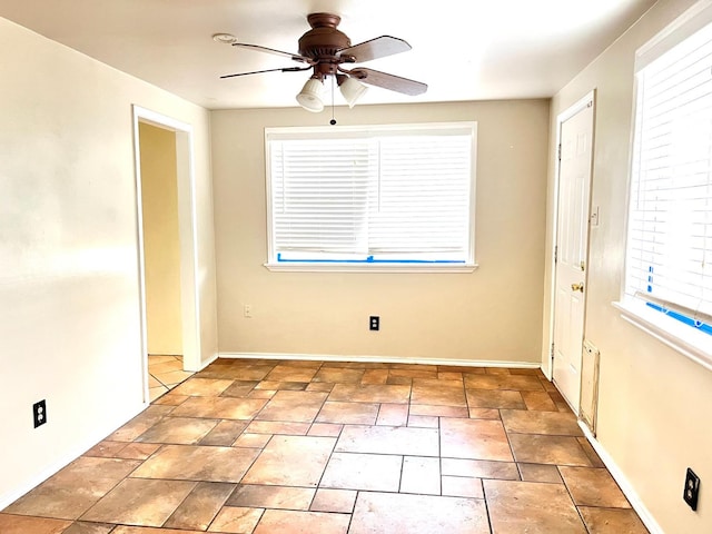 empty room featuring ceiling fan