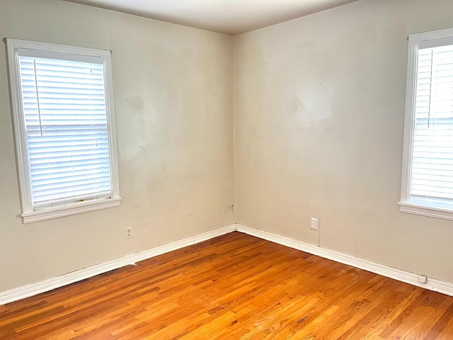 empty room with light hardwood / wood-style floors