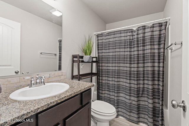 6827 38th St, Lubbock, TX 79407 - full bath featuring vanity, toilet, and shower / bath combination with curtain